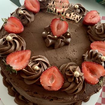 Cynthia's Crumbly Creations - Custom White Cake with Chocolate Buttercream Frosting, Fresh Strawberries & Gold details - Desserts Near Me