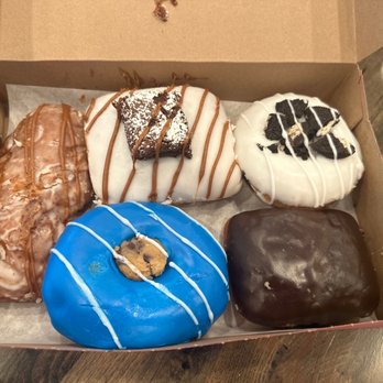 Recharge Coffee Company - a box of assorted donuts - Coffee & Tea Near Me - Bourbonnais, Illinois