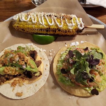 La Carnita - Corn on a cob, Carne asada taco (left), Tostada de ceviche taco (right) - Mexican Near Me - Toronto, Ontario La Carnita - Corn on a cob, Carne asada taco (left), Tostada de ceviche taco (right) - Mexican Near Me - Toronto, Ontario