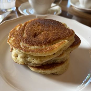 Le Crocodile - The pancakes. They come with berries and cream, but I like them the way they were. - French Near Me - Brooklyn, New York