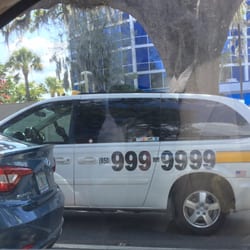 Yellow Cab - 6-22-2016, Driver on phone like this driving south on Bronough St. In rush hour traffic.