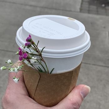 Midtown Coffee - Coffee with Valentine's Day flowers attached to the cup. - Coffee & Tea Near Me - Madras, Oregon