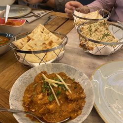Doli - Chicken bhuna with (from bottom to top) cheese, garlic, and plain naan.