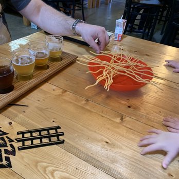 Rockpit Brewing & Distilling - Yeti spaghetti game and juice boxes for the kids and tasting flight for mom and dad - Breweries Near Me - Orlando, Florida Rockpit Brewing & Distilling - Yeti spaghetti game and juice boxes for the kids and tasting flight for mom and dad - Breweries Near Me - Orlando, Florida