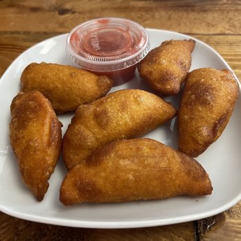 3 in 1 Restaurant - Elena's Empanadas - Six bite sized empanadas filled with almond milk arroz con leche. Served with a Strawberry Habanero sauce - Mexican Near Me - Indianapolis, Indiana