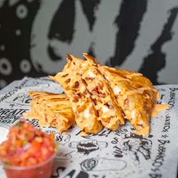 Bubbakoo's Burritos - a stack of burritos - New Mexican Cuisine Near Me - Jonesboro, Georgia