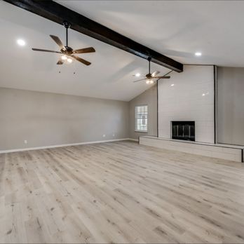 Ark Depot - a spacious living room with hardwood floors - Flooring Near Me - Dallas, Texas