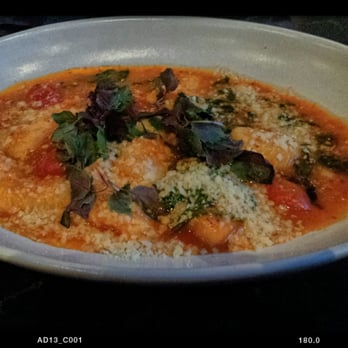 Cento - Pillowy gnocchi in a tomato sauce,  garnished with shiso - Italian Near Me - Madison, Wisconsin