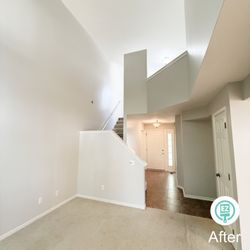 Paint EZ of Grand Rapids - This Kentwood entryway and staircase was completely refreshed with Sherwin-Williams Gossamer Veil, brightening up the entire first floor.