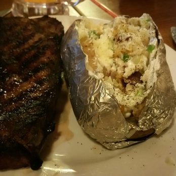Proud Cut Saloon - Hot baked potato but a cool/cold New York strip steak. - Steakhouses Near Me - Cody, Wyoming Proud Cut Saloon - Hot baked potato but a cool/cold New York strip steak. - Steakhouses Near Me - Cody, Wyoming