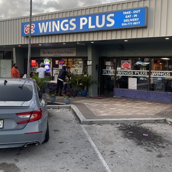 Wings Plus - a car parked in a parking lot - Chicken Wings Near Me - Fort Lauderdale, Florida Wings Plus - a car parked in a parking lot - Chicken Wings Near Me - Fort Lauderdale, Florida