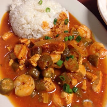 Chez Olga - Shrimp and chicken gumbo with white rice. Has okra and white onions - Caribbean Near Me - Grand Rapids, Michigan
