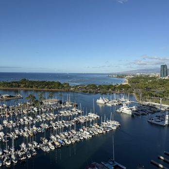 Prince Waikiki - 2 bedroom suite. Sliding window opened, view of yacht club dock + overlooking Ala Moana Beach + Park. - Hotels Near Me - Honolulu, Hawaii