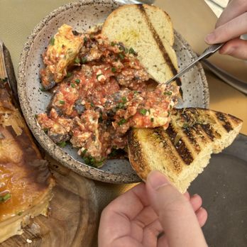 Krasi - Grilled sourdough with topping of tomatoes and mushrooms - Mediterranean Near Me - Boston, Massachusetts