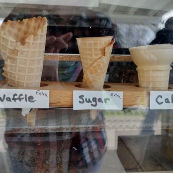 Scoops - Types of cones available with a visual aid: Cake, sugar, and waffles.  Dipped waffle cones also sold! - Ice Cream & Frozen Yogurt Near Me - Yorkshire, New York