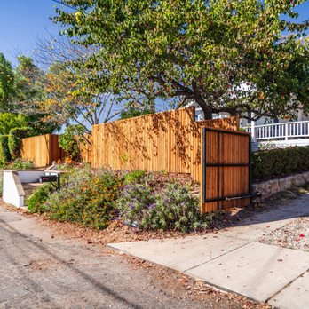 Bay Construction - We replaced an old white fence with a custom rough redwood design -- adding warmth, privacy, and major curb appeal to this home. - General Contractors Near Me - Santa Barbara, California Bay Construction - We replaced an old white fence with a custom rough redwood design -- adding warmth, privacy, and major curb appeal to this home. - General Contractors Near Me - Santa Barbara, California