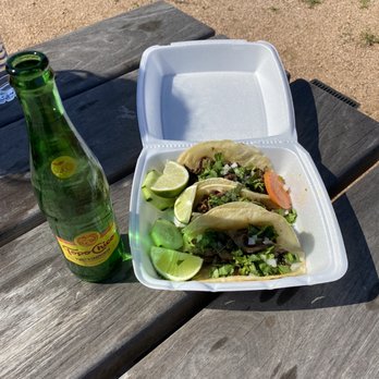 Rico Taqueria - a bottle of beer and a plate of tacos - Food Trucks Near Me - Gainesville, Texas Rico Taqueria - a bottle of beer and a plate of tacos - Food Trucks Near Me - Gainesville, Texas