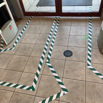 Starbucks - a line of caution tape taped around the entrance of a coffee shop - Coffee & Tea Near Me - Edmonton, Alberta Starbucks - a line of caution tape taped around the entrance of a coffee shop - Coffee & Tea Near Me - Edmonton, Alberta