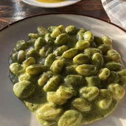 Foreground: Pesto Gnocchi Al Pesto Background: Tortelloni Al Brasato Foreground: Pesto Gnocchi Al Pesto Background: Tortelloni Al Brasato