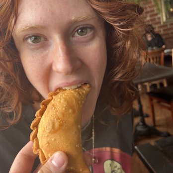 Solar de Cahuenga - Beautiful woman eating an empanada - Breakfast & Brunch Near Me - Los Angeles, California Solar de Cahuenga - Beautiful woman eating an empanada - Breakfast & Brunch Near Me - Los Angeles, California