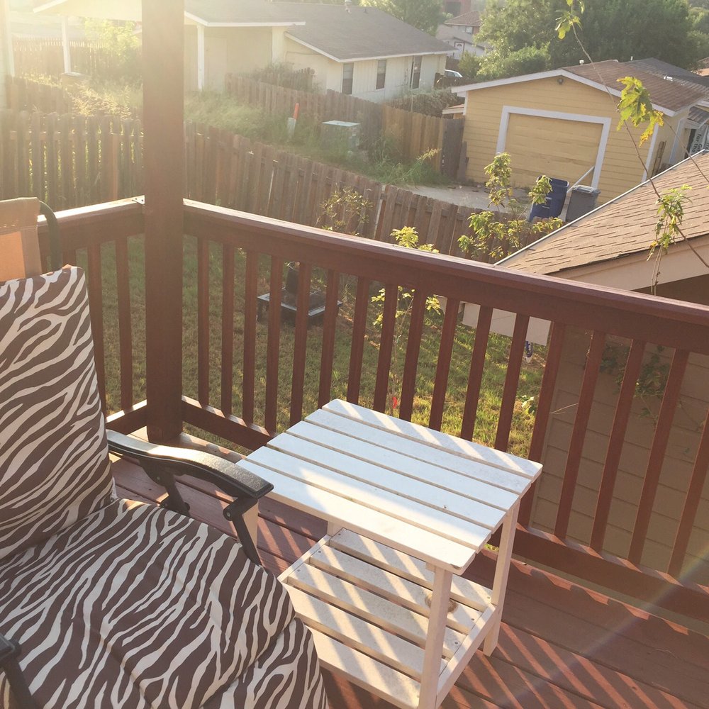 Michael Sooby Carpentry - a chair and table on a deck - General Contractors Near Me - Austin, Texas Michael Sooby Carpentry - a chair and table on a deck - General Contractors Near Me - Austin, Texas
