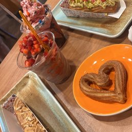 Vegan Vanilla Yogurt with fruit and m&m topping, frozen yogurt, Pistachio Raspberry churro, Dulce De Leche churro and heart churro Vegan Vanilla Yogurt with fruit and m&m topping, frozen yogurt, Pistachio Raspberry churro, Dulce De Leche churro and heart churro