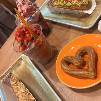La Niña Churreria - Vegan Vanilla Yogurt with fruit and m&m topping, frozen yogurt, Pistachio Raspberry churro, Dulce De Leche churro and heart churro - Desserts Near Me - Troy, Michigan La Niña Churreria - Vegan Vanilla Yogurt with fruit and m&m topping, frozen yogurt, Pistachio Raspberry churro, Dulce De Leche churro and heart churro - Desserts Near Me - Troy, Michigan
