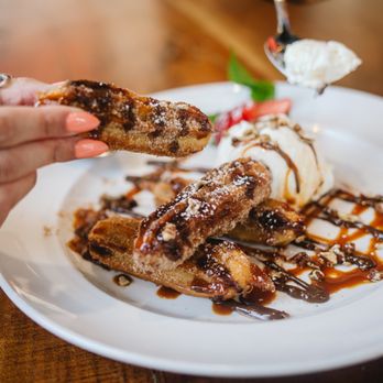 Barrio Queen - a plate of food with ice cream and chocolate sauce - Mexican Near Me - Tempe, Arizona