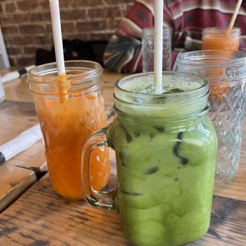 Pure Bistro - a green smoothie and a orange smoothie - Juice Bars & Smoothies Near Me - Brooklyn, New York