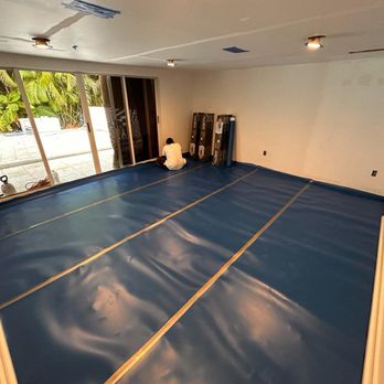 WeDo Services - a room with a blue floor - Handyman Near Me WeDo Services - a room with a blue floor - Handyman Near Me