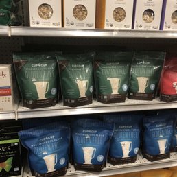 a variety of coffee bags on a shelf a variety of coffee bags on a shelf