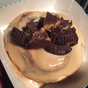 Cinnaholic - A coffee frosted cinnamon roll topped with peanut butter cups. - Bakeries Near Me - Schaumburg, Illinois Cinnaholic - A coffee frosted cinnamon roll topped with peanut butter cups. - Bakeries Near Me - Schaumburg, Illinois