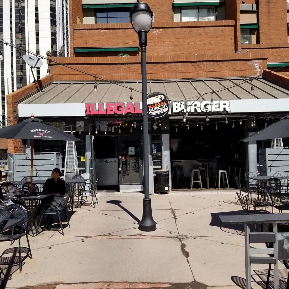 Illegal Burger - Writer Square - Outside sign & seating pictured - Burgers Near Me - Denver, Colorado Illegal Burger - Writer Square - Outside sign & seating pictured - Burgers Near Me - Denver, Colorado