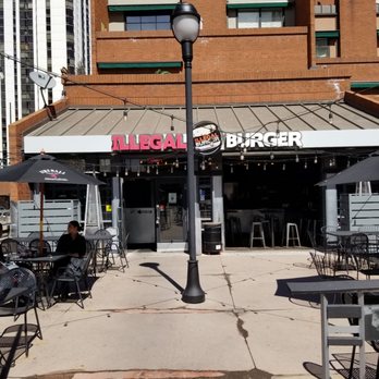 Illegal Burger - Writer Square - Outside sign & seating pictured - Burgers Near Me - Denver, Colorado Illegal Burger - Writer Square - Outside sign & seating pictured - Burgers Near Me - Denver, Colorado