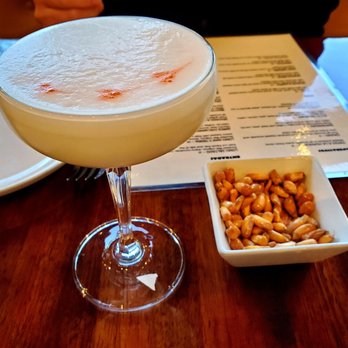 Costa Contemporary Kitchen - Pisco Sour (lime, simple syrup, pisco & egg white) - Peruvian Near Me - Costa Mesa, California Costa Contemporary Kitchen - Pisco Sour (lime, simple syrup, pisco & egg white) - Peruvian Near Me - Costa Mesa, California