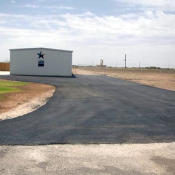 West Tex Paving - a paved driveway with a building in the background - General Contractors Near Me - Odessa, Texas West Tex Paving - a paved driveway with a building in the background - General Contractors Near Me - Odessa, Texas