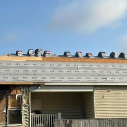 REV Renovations - Removal of shingles and new synthetic felt on roof