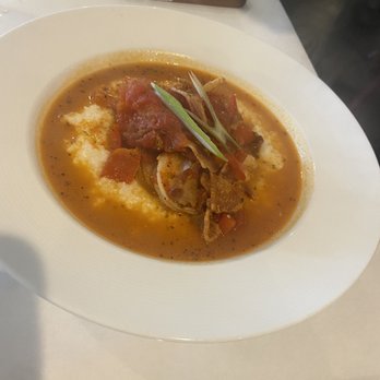 Stella's Southern Bistro - Shrimp & Grits were outstanding!! Included bacon, tomatoes and a hint of heat. - New American Near Me - Simpsonville, South Carolina Stella's Southern Bistro - Shrimp & Grits were outstanding!! Included bacon, tomatoes and a hint of heat. - New American Near Me - Simpsonville, South Carolina