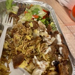 a plate of food with rice and meat a plate of food with rice and meat