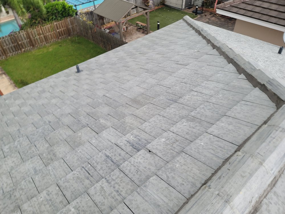 Slide of JMR Roofing Services