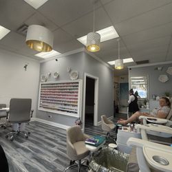 Splendid Mani Pedi - Nail polish selection and pedicure chairs.
