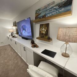 Reza Custom Cabinet & Vanity - The counter-height desk next to a window is perfect for remote work.