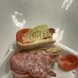 Great slice of lettuce and rotten tomato Great slice of lettuce and rotten tomato
