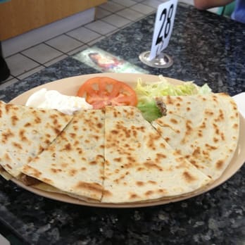 Lucky Star Cafe - Carne asada quesadilla, but WHO took a bite! ;-) - Mexican Near Me - Carson, California Lucky Star Cafe - Carne asada quesadilla, but WHO took a bite! ;-) - Mexican Near Me - Carson, California