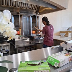 Mediterranean Bakery & Cuisine - Carving the beef shawarma