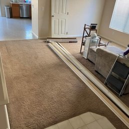 So much carpet, random tile near the door & the kitchen was thin, off white, budget lenoleum.