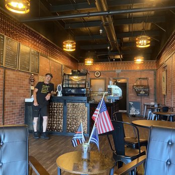 The Jacked Up Bean - a man and a woman standing in a coffee shop - Coffee & Tea Near Me - Palm Coast, Florida