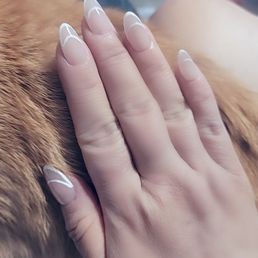 Short Almond Shaped Gel X with French Tip Design.