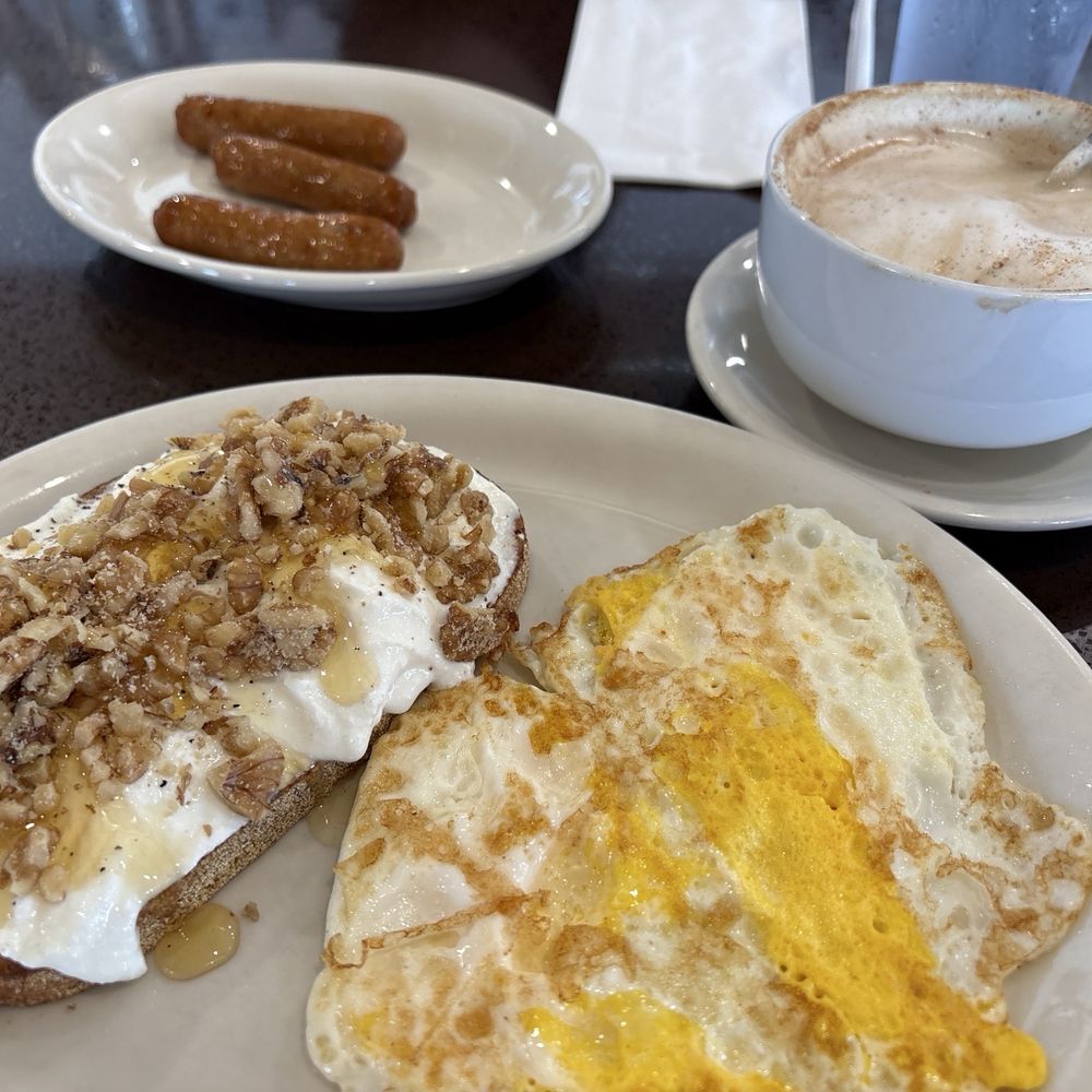 Honey ricotta toast with eggs ( over hard) and a side of sausage and vanilla cappuccino!!! Honey ricotta toast with eggs ( over hard) and a side of sausage and vanilla cappuccino!!!