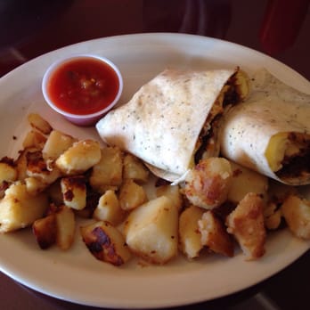 The Howling Rooster - Breakfast burrito. Ground beef, eggs, sour cream. Potatoes and salsa in the side. - Breakfast & Brunch Near Me - Buffalo, New York The Howling Rooster - Breakfast burrito. Ground beef, eggs, sour cream. Potatoes and salsa in the side. - Breakfast & Brunch Near Me - Buffalo, New York